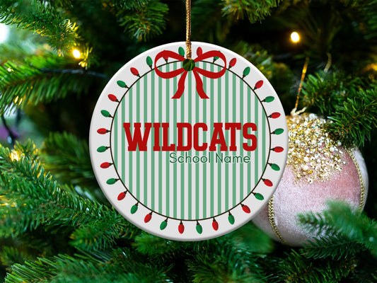 Round ornament with "WILDCATS" and "School Name" on green and white stripes.