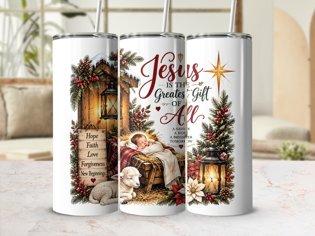 Three tall white tumblers with straws feature a nativity scene design including text reading Jesus is the Greatest Gift of All.