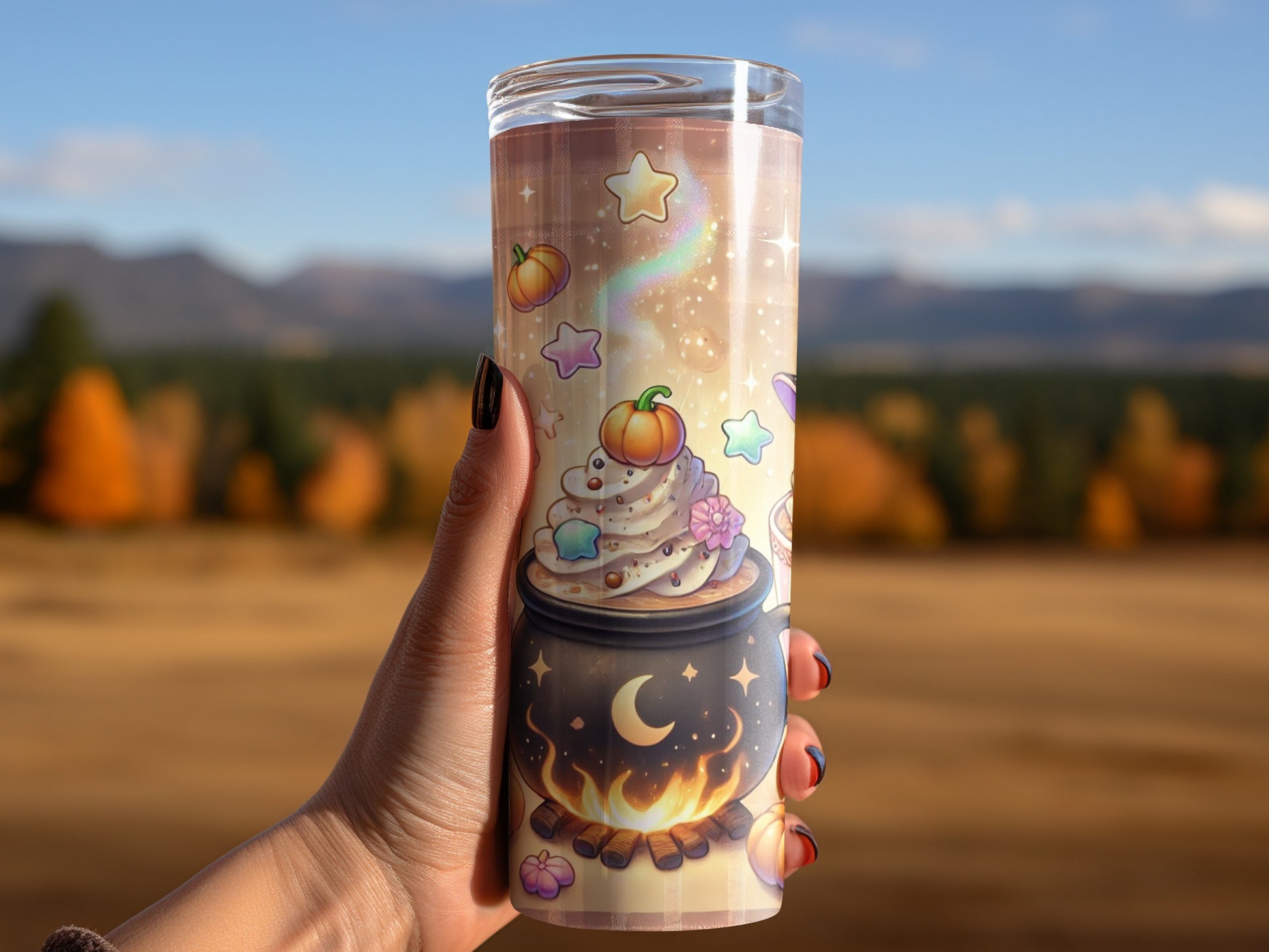 Tumbler with a witch's cauldron and pumpkin whipped cream design.