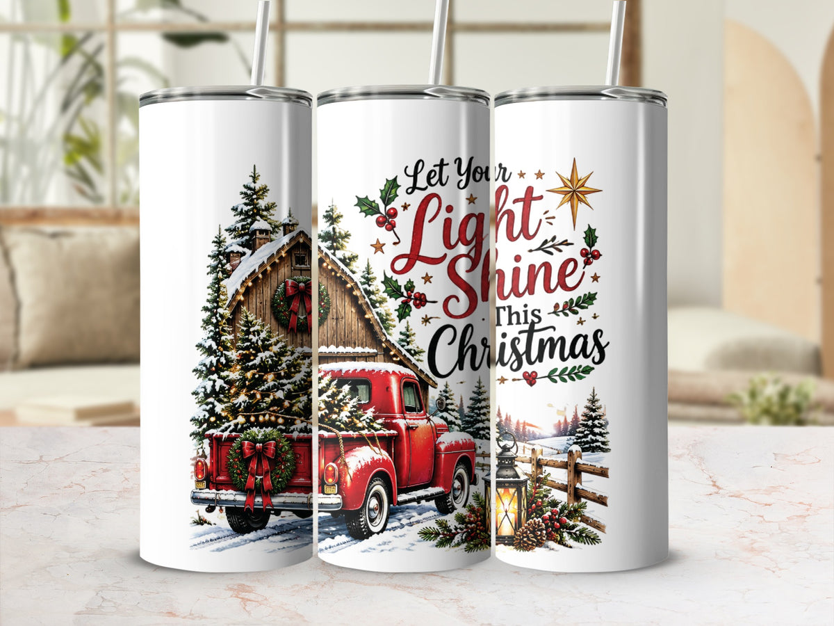 Three tall, white tumblers with straws feature a winter Christmas design with a red truck, barn, and text.