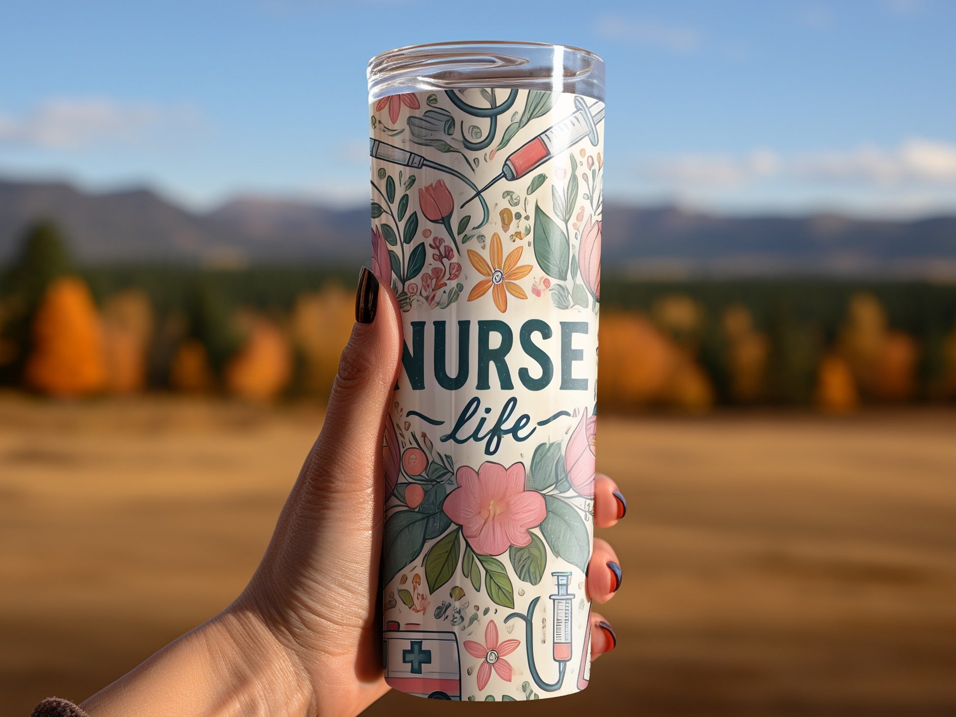 Tumbler with floral and medical designs, reading "Nurse Life".