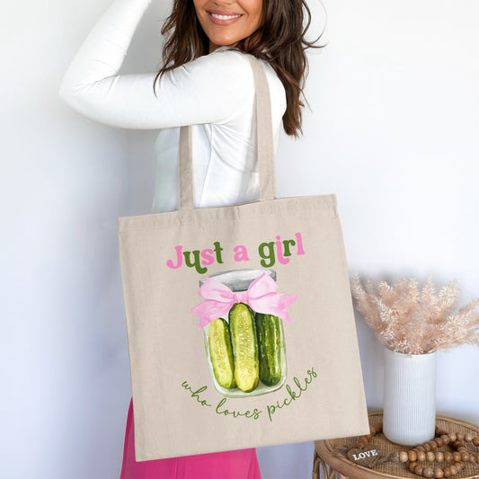Canvas tote bag with "Just a girl who loves pickles" text and pickle jar illustration.