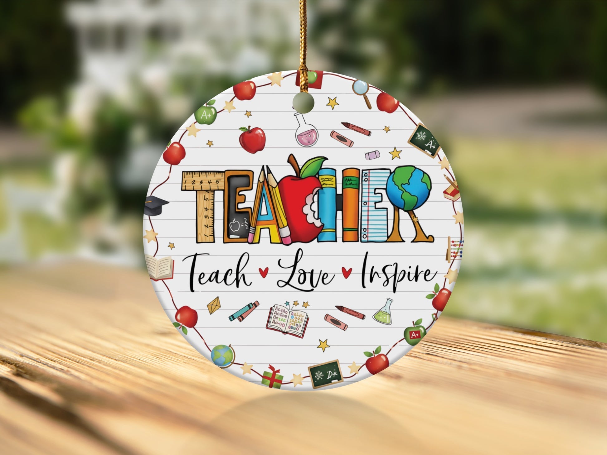 Round ornament with "TEACHER" text and school-themed icons.