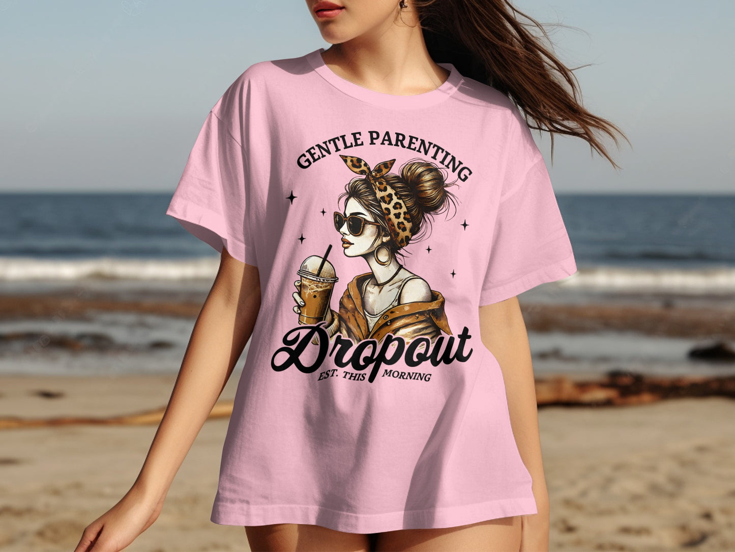 Pink t-shirt with "Gentle Parenting Dropout" text and a woman holding a drink.