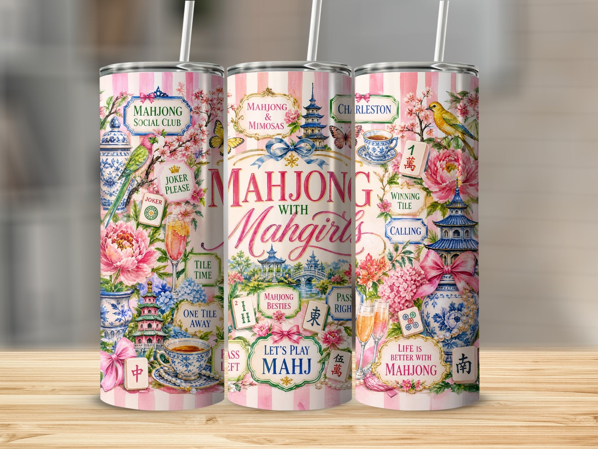 Three tumblers with pink stripes, adorned with whimsical Mahjong motifs and text.