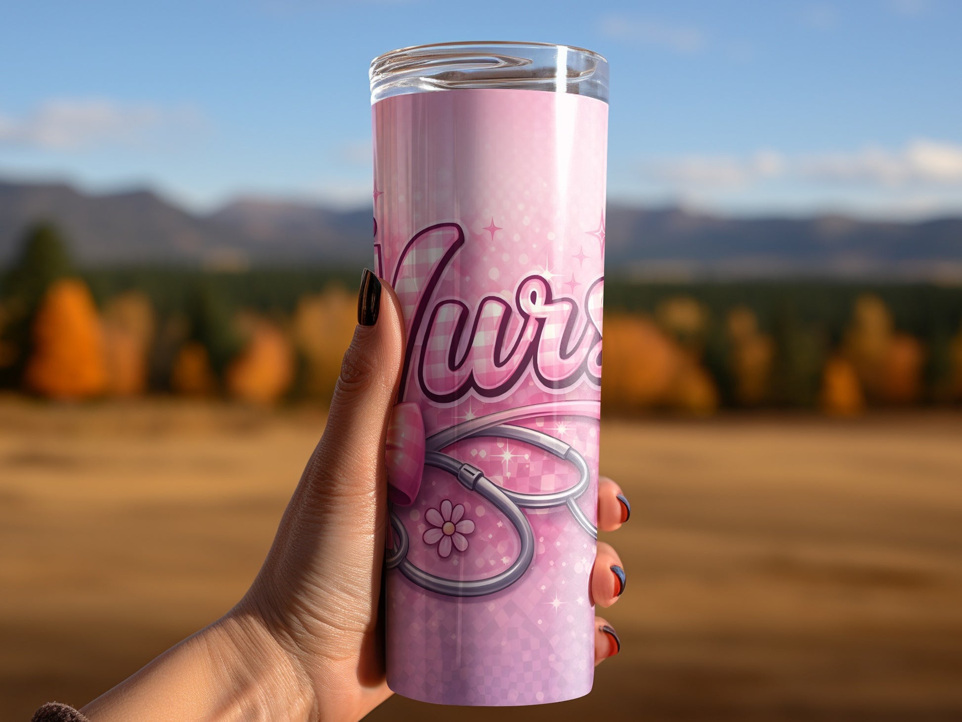 Pink tumbler with "Nurse" and stethoscope design, held by a hand.