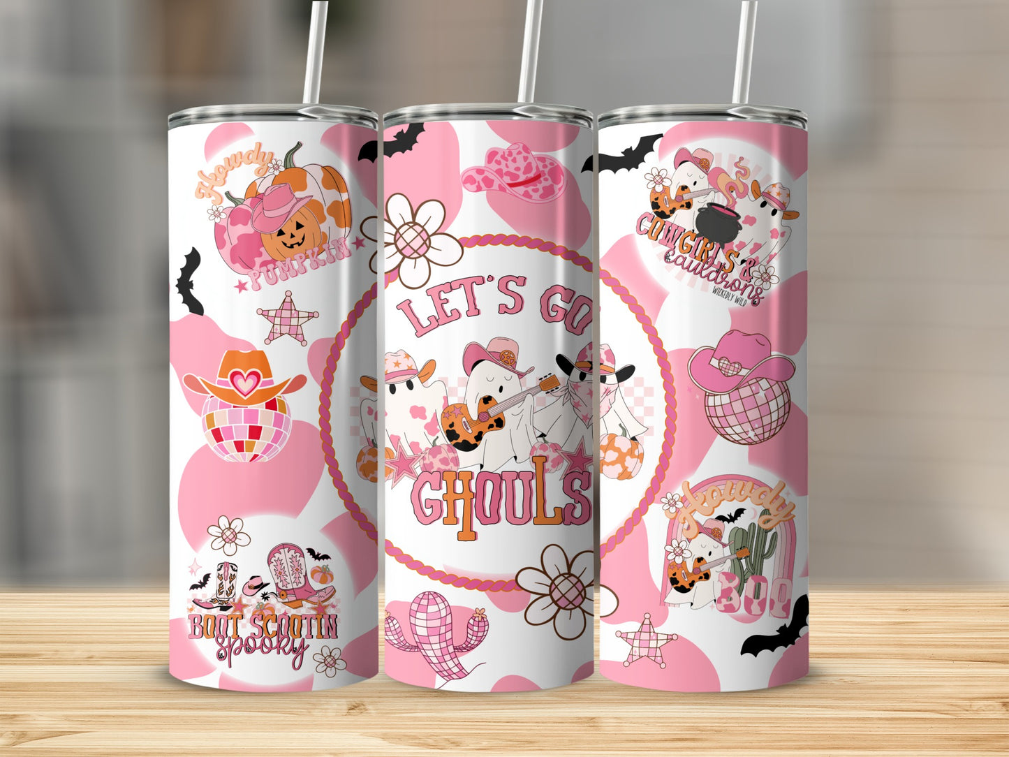 Tumbler with pink cow print, pumpkins, boots, cacti, and ghosts with text "Let's Go Ghouls".