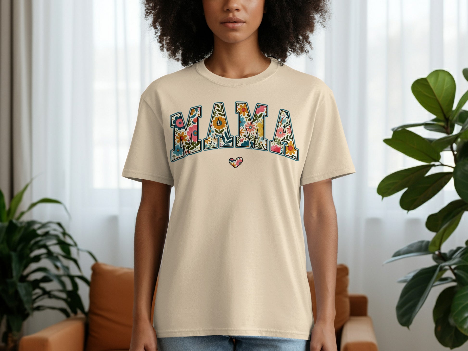 Beige t-shirt with "MAMA" in floral letters and a heart graphic.