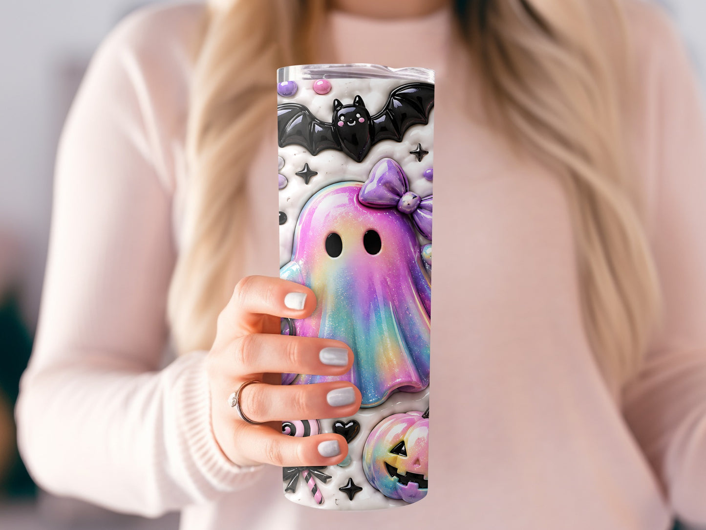 Tumbler with a rainbow ghost, bat, pumpkin, and candy Halloween design.