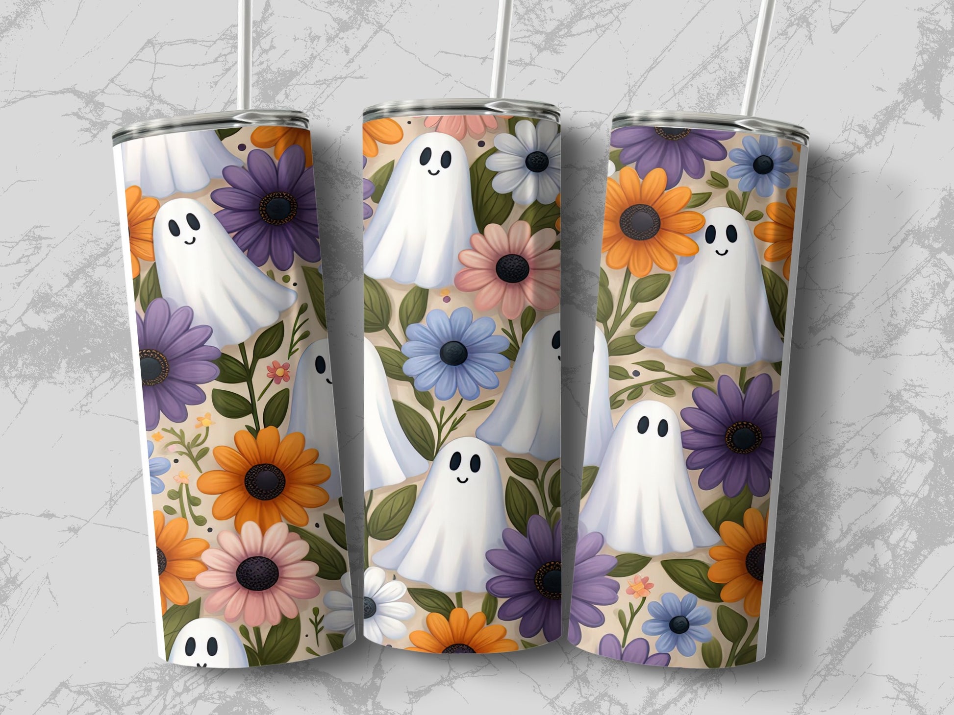 Three tumblers displaying a white ghost and floral pattern with orange, purple, and blue flowers.