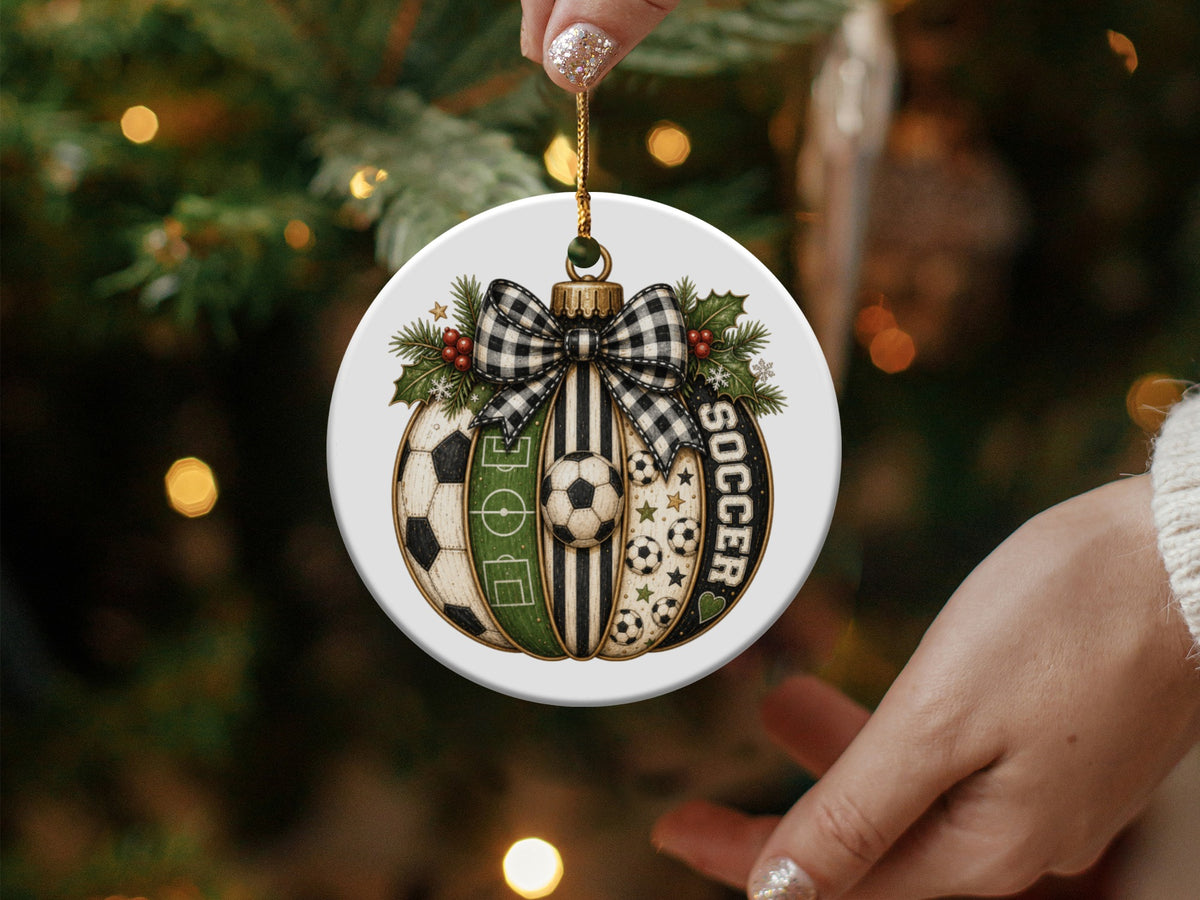 Round soccer-themed Christmas ornament with plaid bow and greenery.
