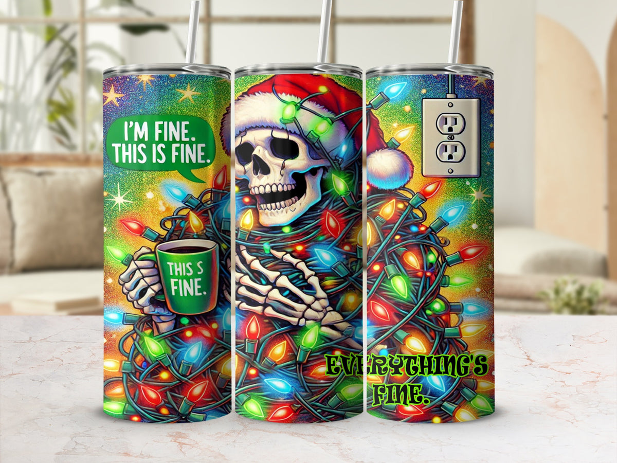 Three identical stainless steel tumblers stand on a counter, featuring a wrap-around graphic of a skeleton tangled in Christmas lights, wearing a Santa hat, and holding a mug that says This Is Fine.