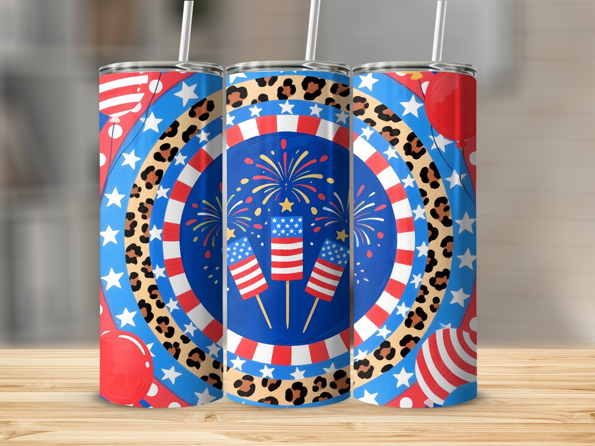 Three tumblers with patriotic fireworks, flags, and leopard print designs.