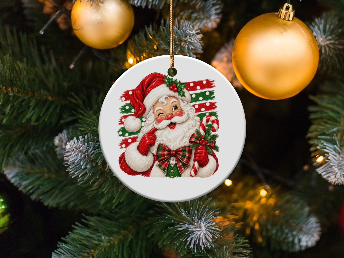 Christmas ornament featuring a winking Santa Claus holding a candy cane.