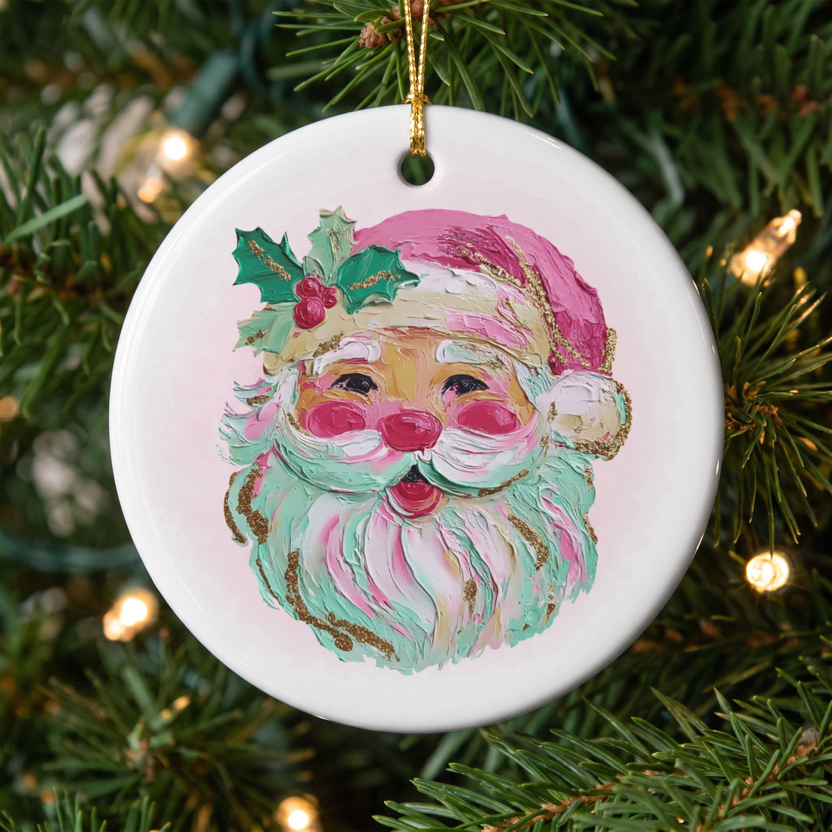Round ceramic ornament with a textured painting of Santa's face and holly.