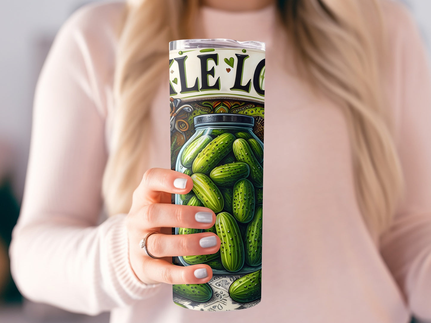 Woman holding a pickle jar tumbler with "pickle love" text.