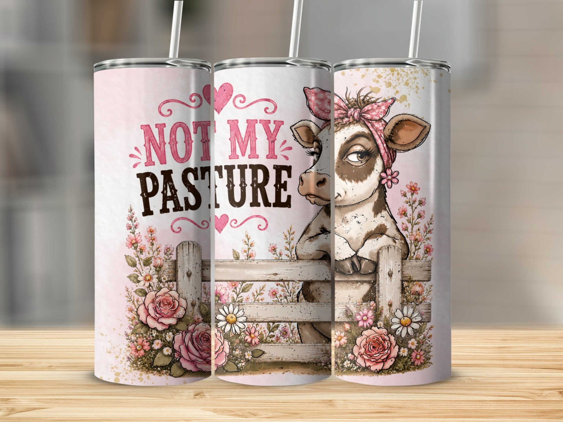 Tumbler with cow, flowers, fence, and text "Not My Pasture".