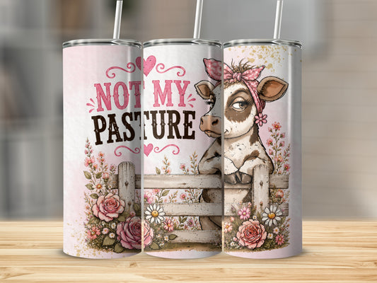 Tumbler with cow, flowers, fence, and text "Not My Pasture".