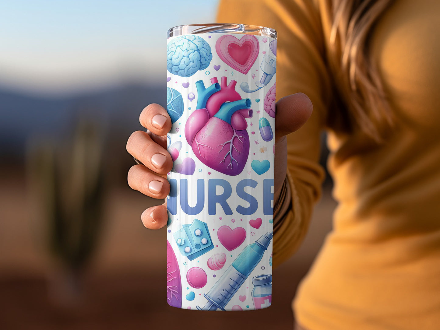 Tumbler with nurse-themed illustrations including a heart, brain, and syringe.