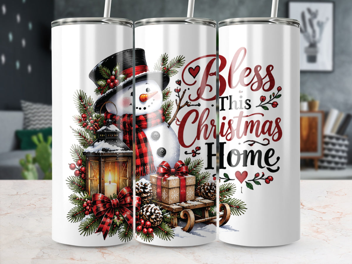 Three white cylindrical tumblers featuring a Christmas design with a snowman, lantern, wrapped gifts, and text reading "Bless This Christmas Home".