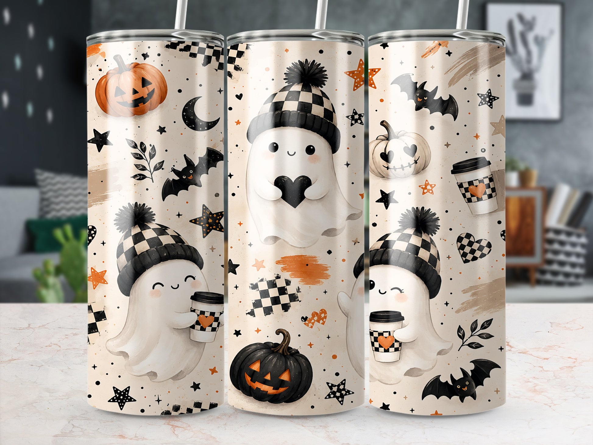 Three tumblers with a Halloween ghost and pumpkin design and checkered patterns.