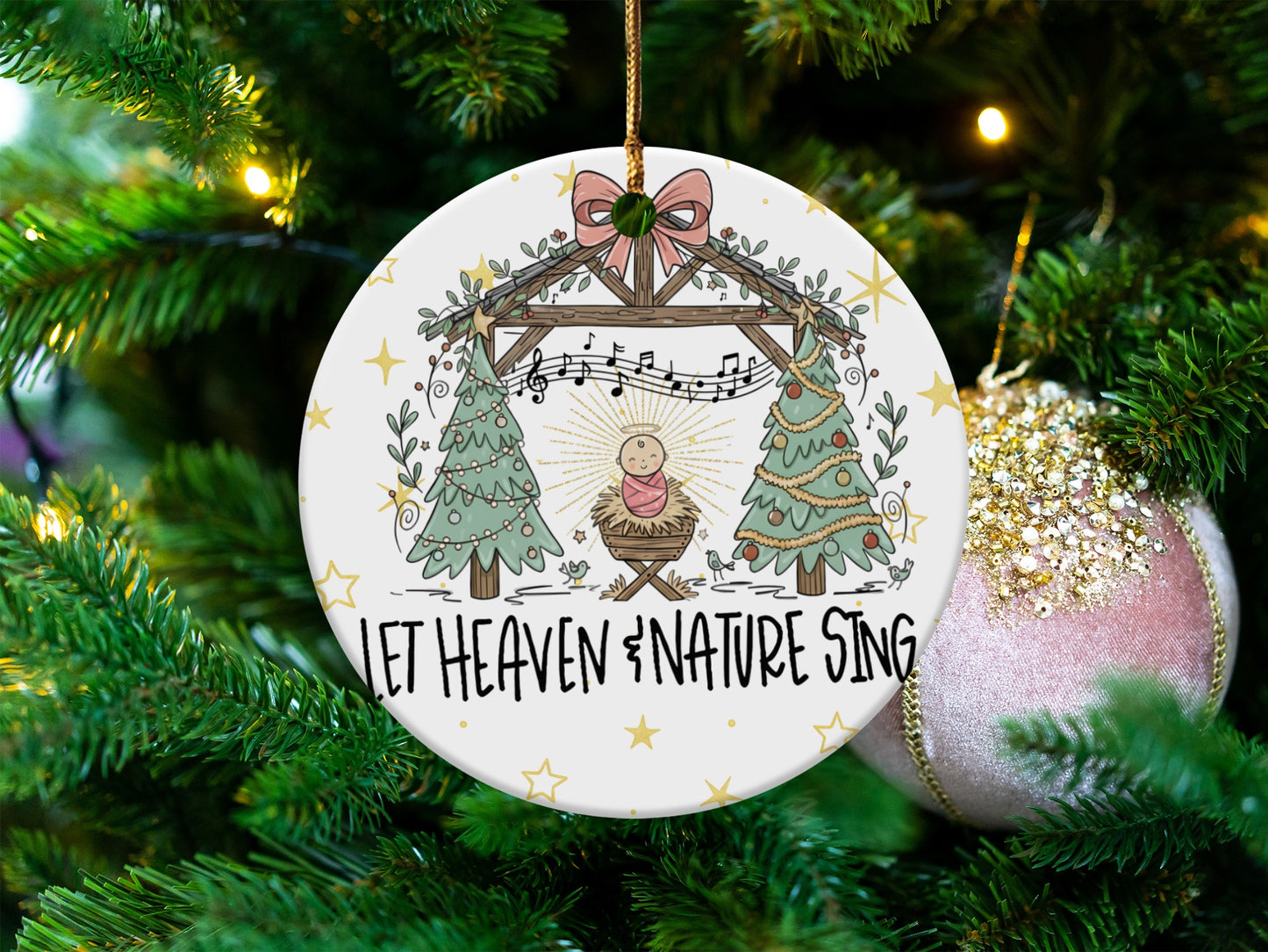Christmas ornament with nativity scene and text "Let Heaven & Nature Sing".