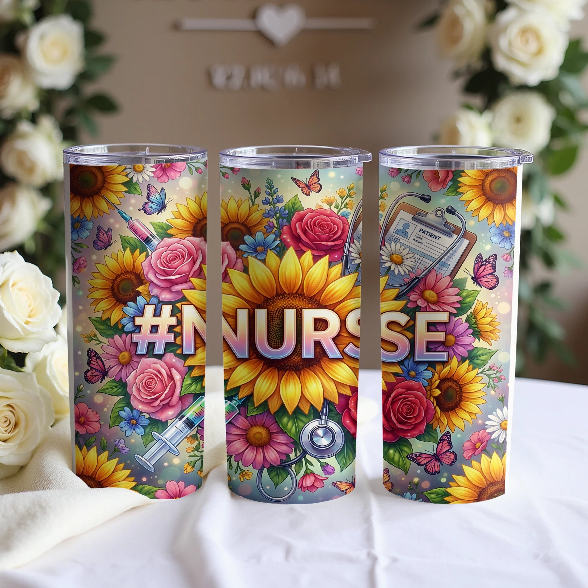 Three tumblers decorated with sunflowers, roses, butterflies, and medical imagery.