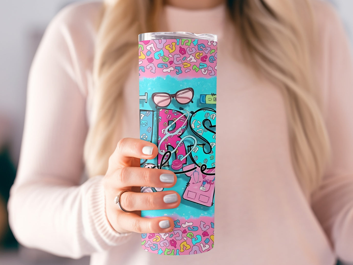 Colorful tumbler with "RN" graphic and medical icons, held by a woman.