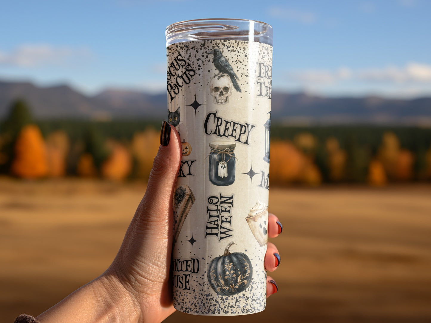 Tumbler with Halloween graphics: crow, skull, ghost, pumpkin, "Trick or Treat."