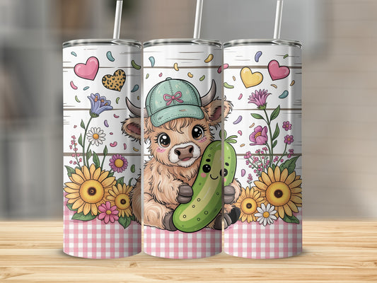 Cute Highland cow wearing a green hat holding a pickle, surrounded by flowers.