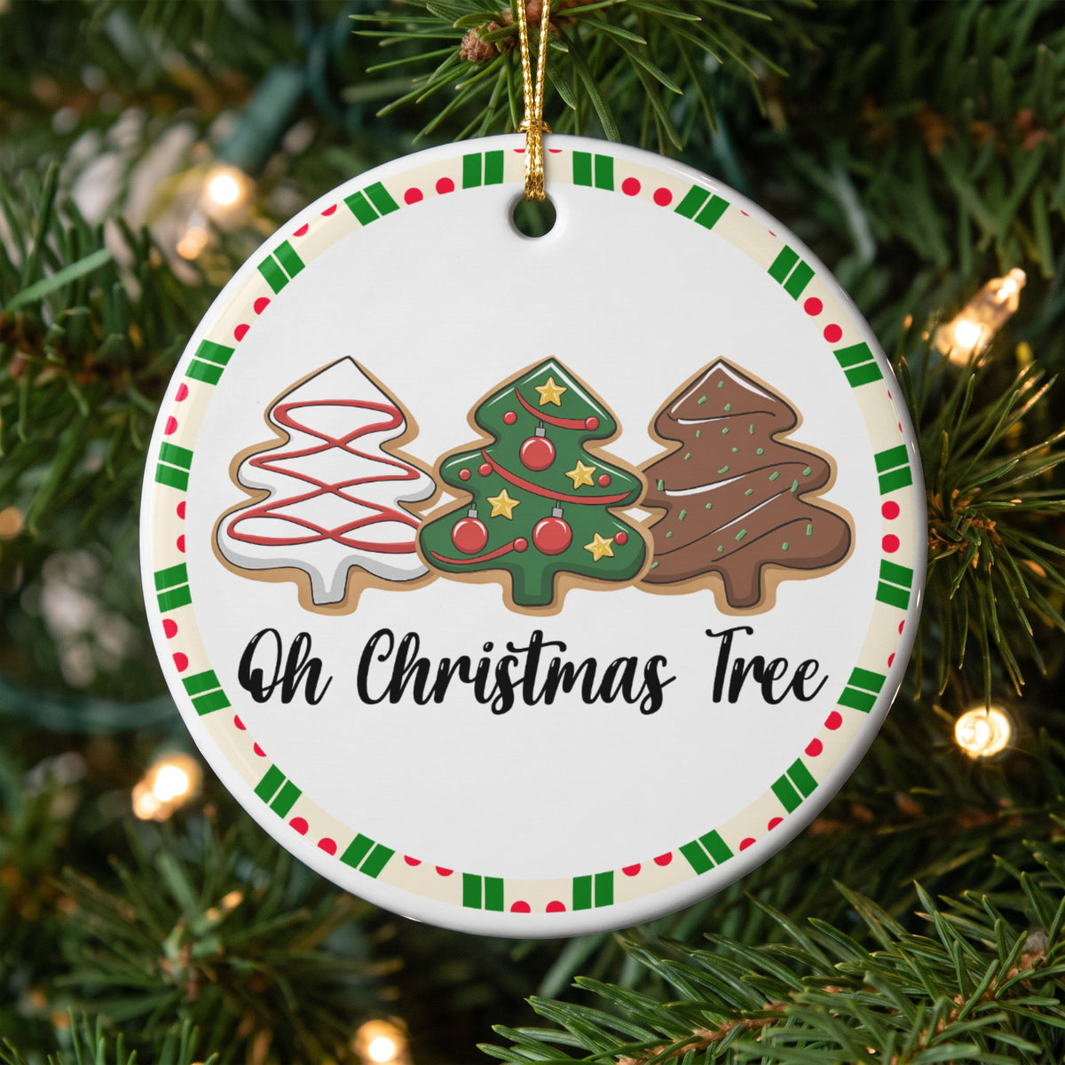 Round ornament with three decorated Christmas tree cookies and text "Oh Christmas Tree".