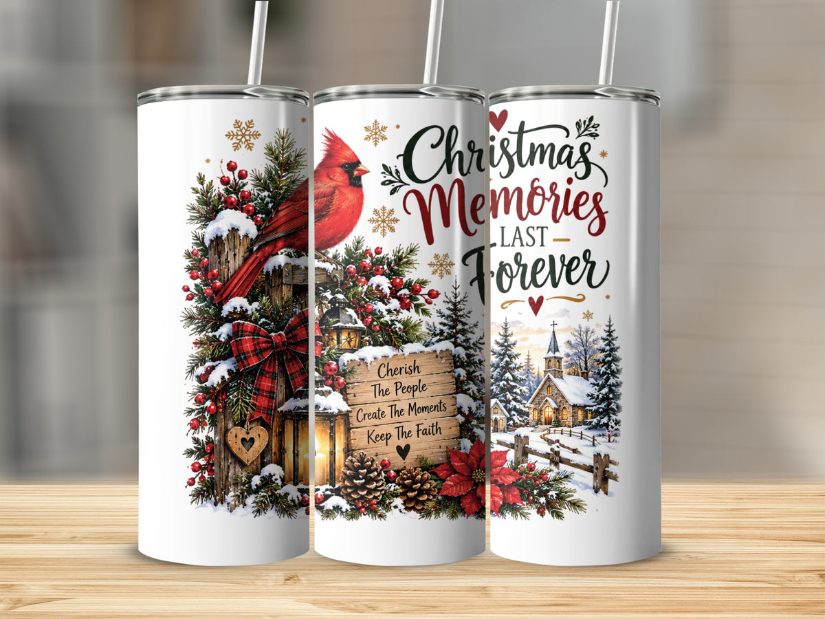 Three white travel tumblers featuring Christmas designs with a cardinal, pine branches, lanterns, and snowy church scene.