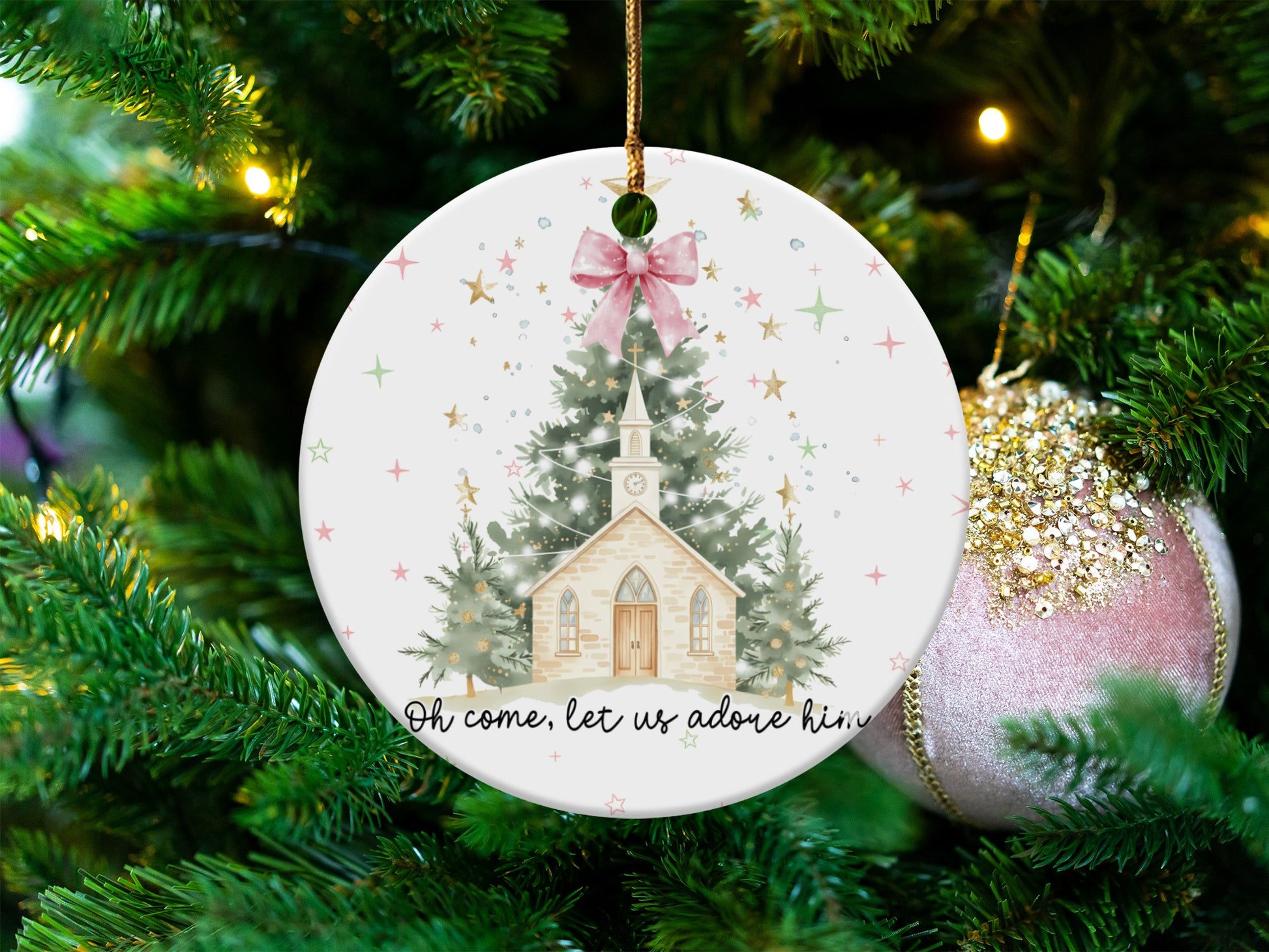 Christmas ornament with church scene and "Oh come, let us adore him" text.