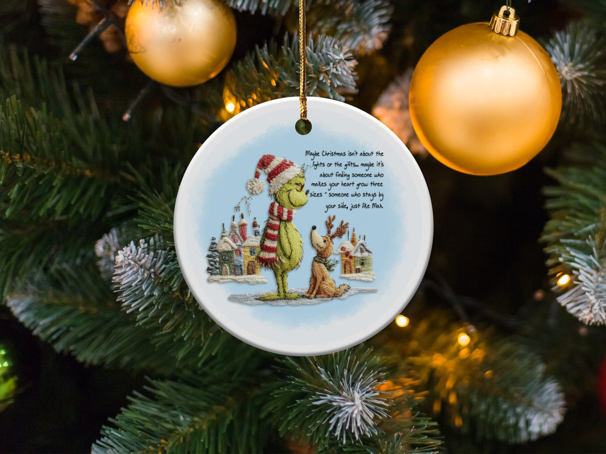 Grinch and Max ornament with Christmas quote, hanging on a tree.