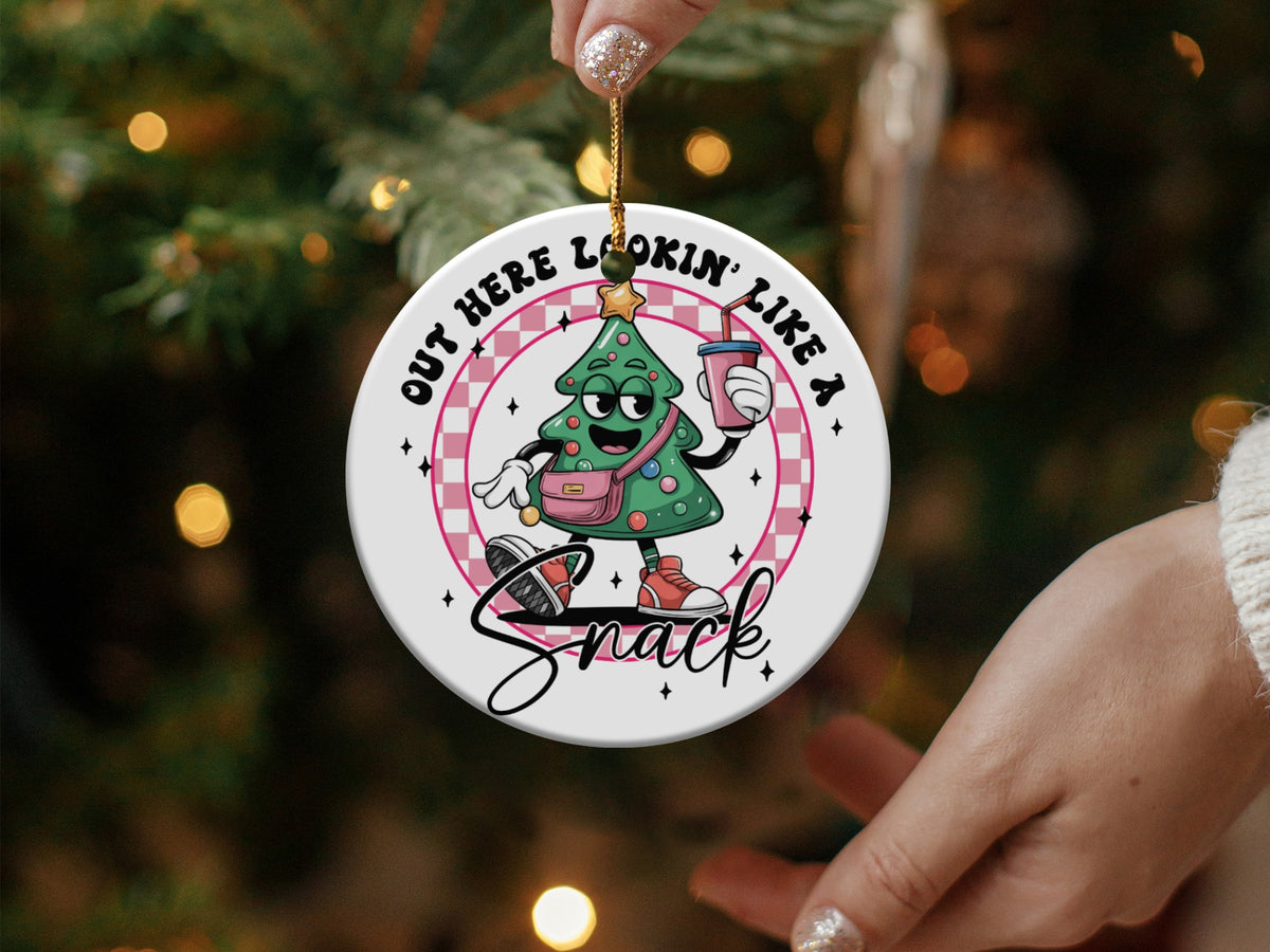 Christmas tree ornament with text "Out Here Lookin' Like a Snack".