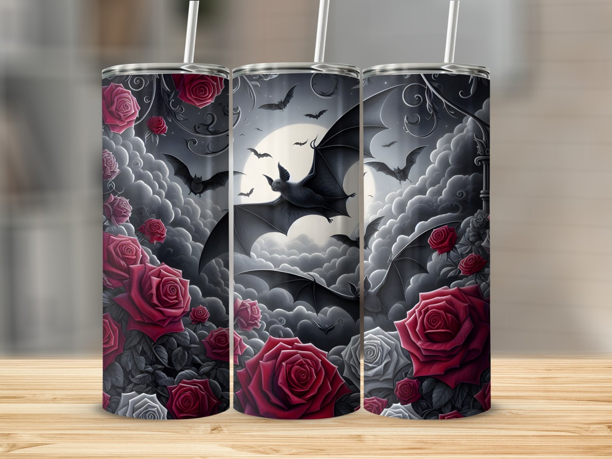 Three tumblers with a gothic design featuring bats, roses, and clouds against a moonlit sky.