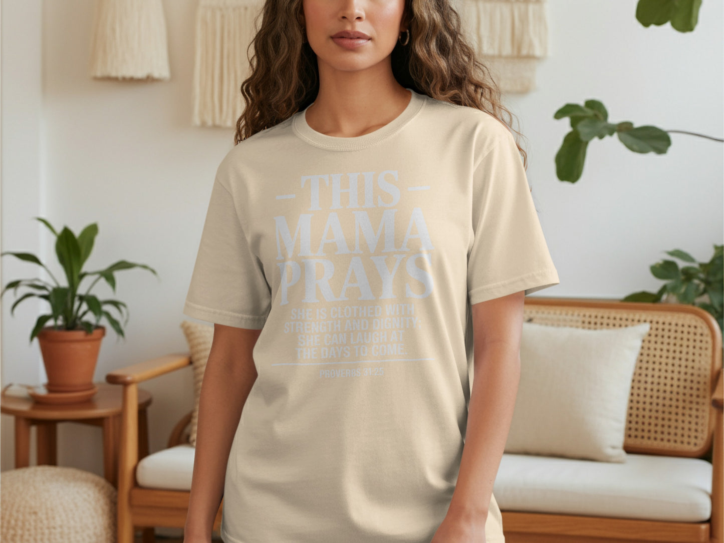 Beige t-shirt with text "This Mama Prays Proverbs 31:25".