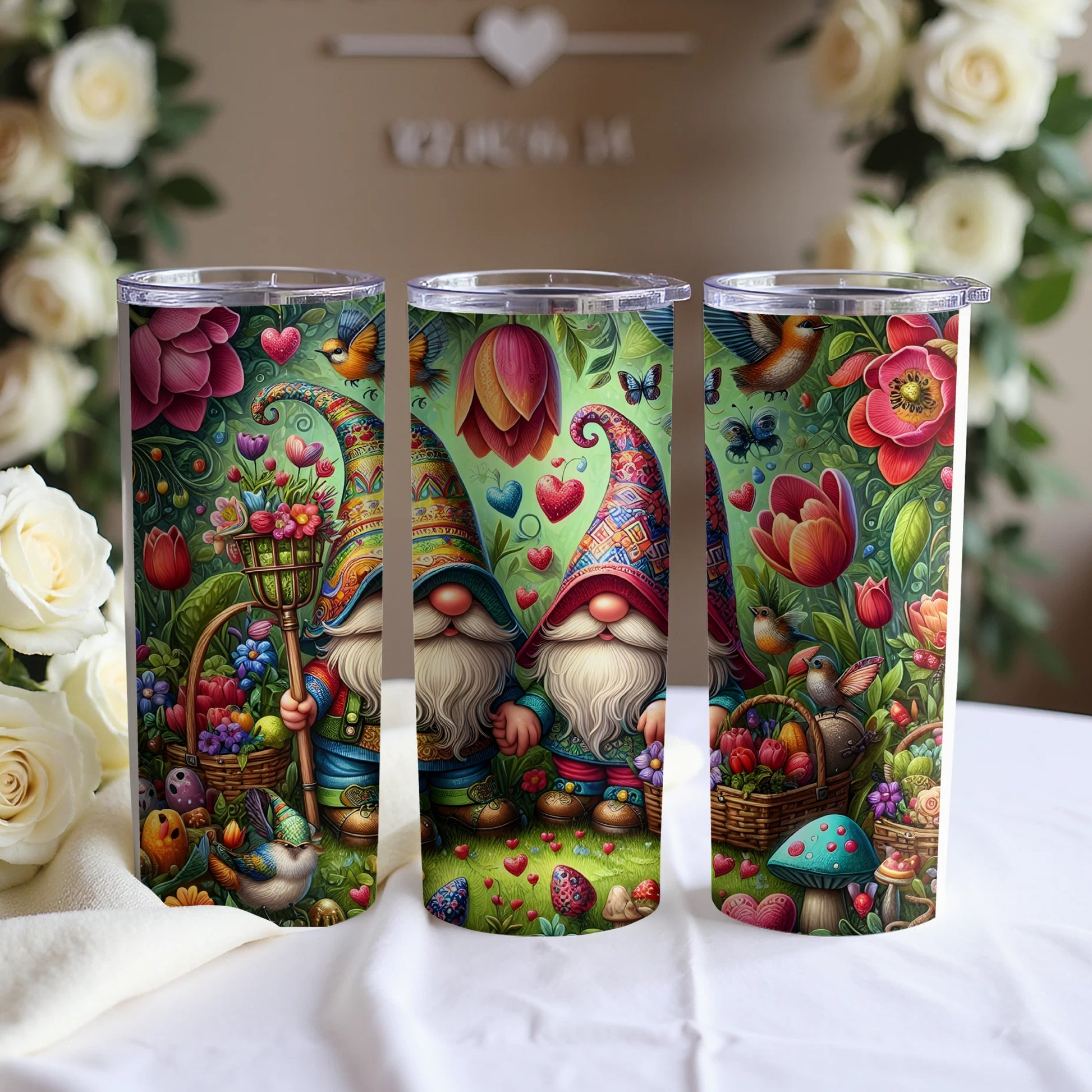 Three gnomes in colorful hats and outfits surrounded by flowers and greenery.