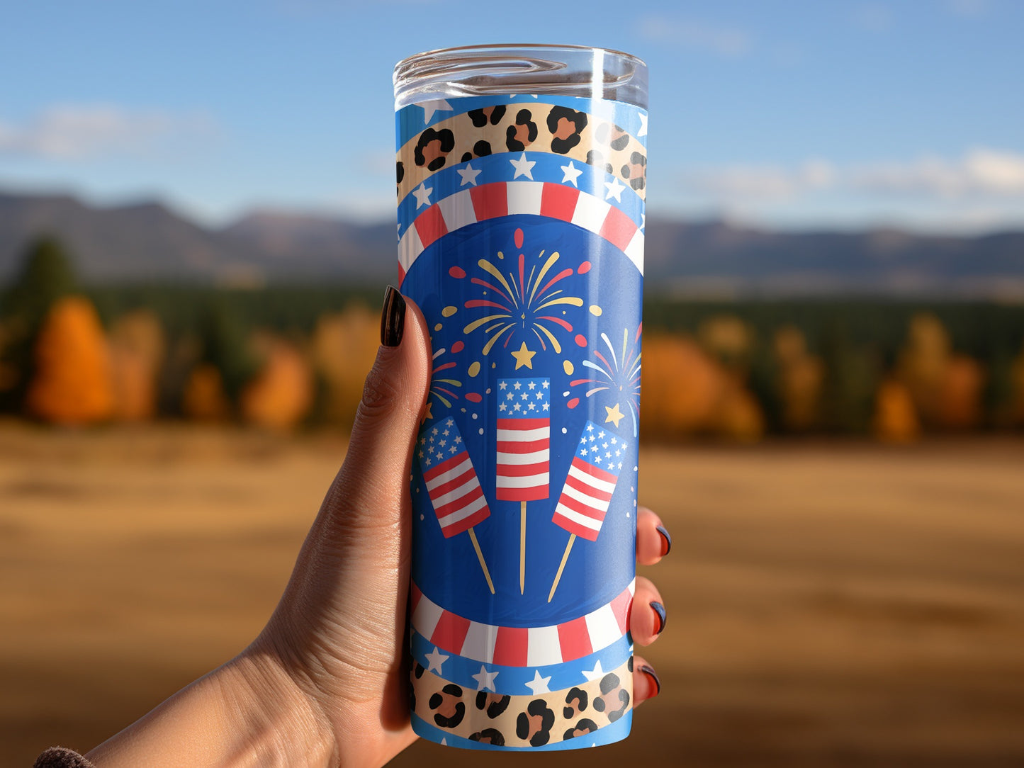 Tumbler with fireworks, American flags, and leopard print.