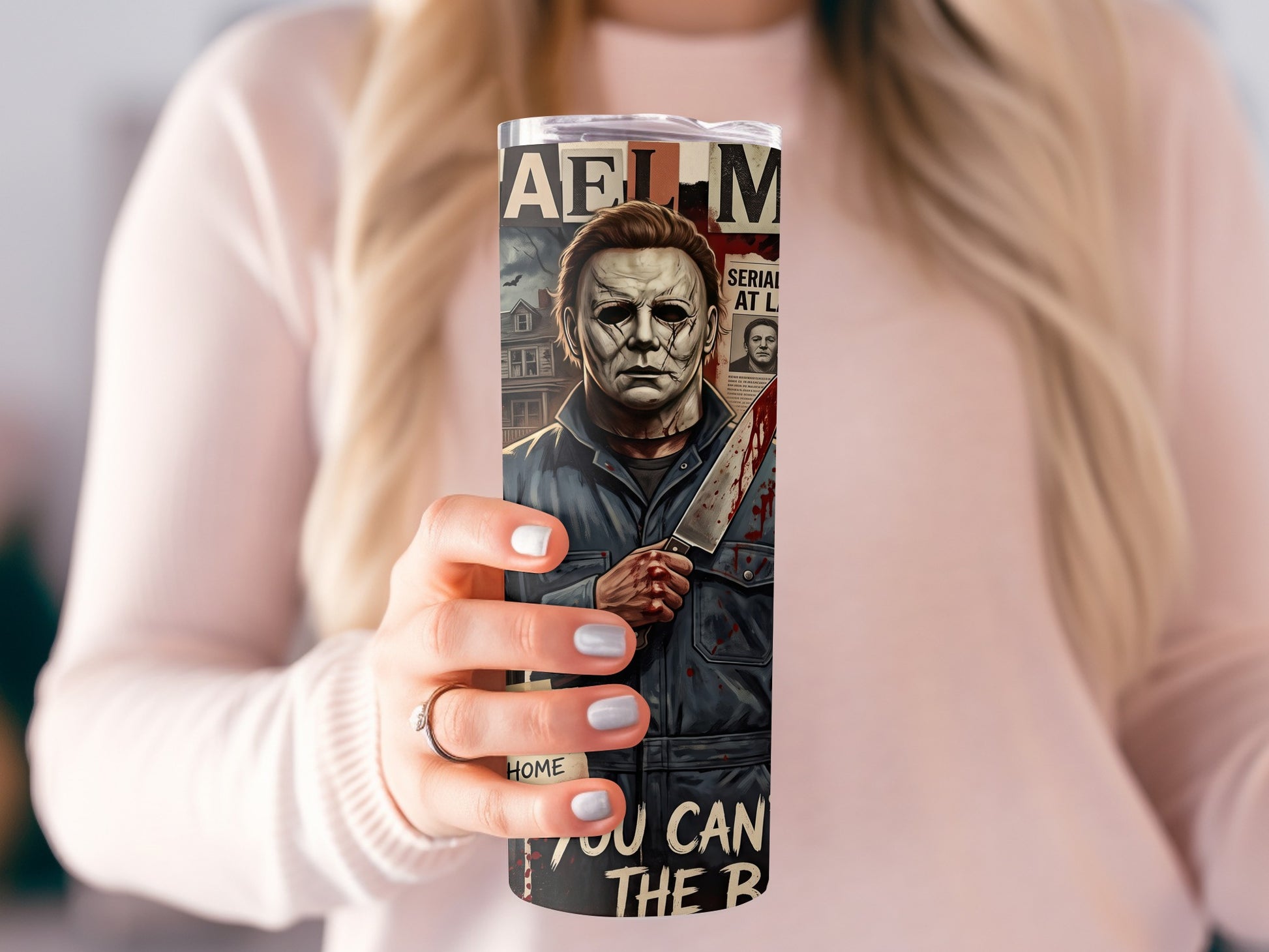 Michael Myers holding a bloody knife on a tumbler with "HAEL M" and text.