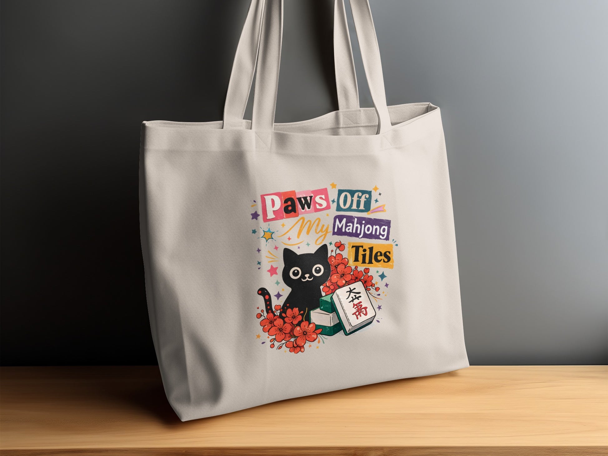 Tote bag with a black cat design stating "Paws Off My Mahjong Tiles."