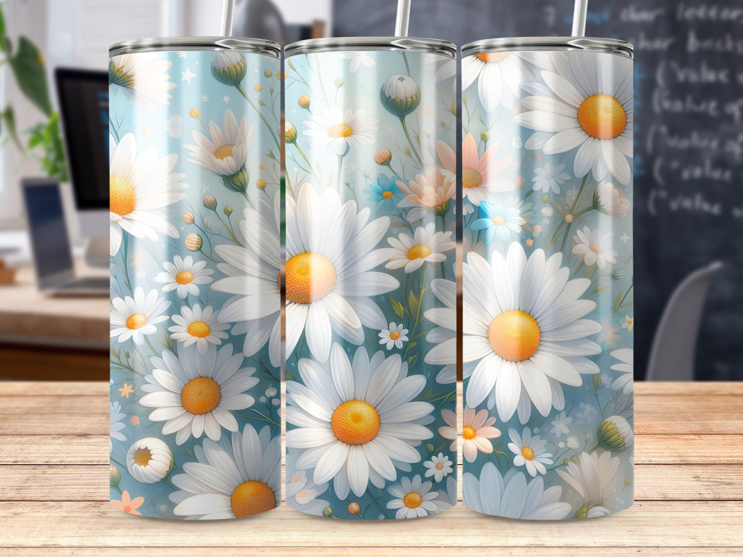 Three tumblers with a white daisy floral pattern on a light blue background.
