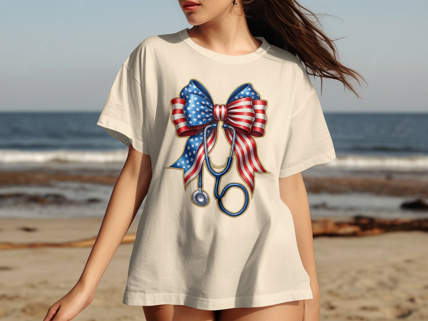 T-shirt with patriotic bow and stethoscope graphic on a beach.