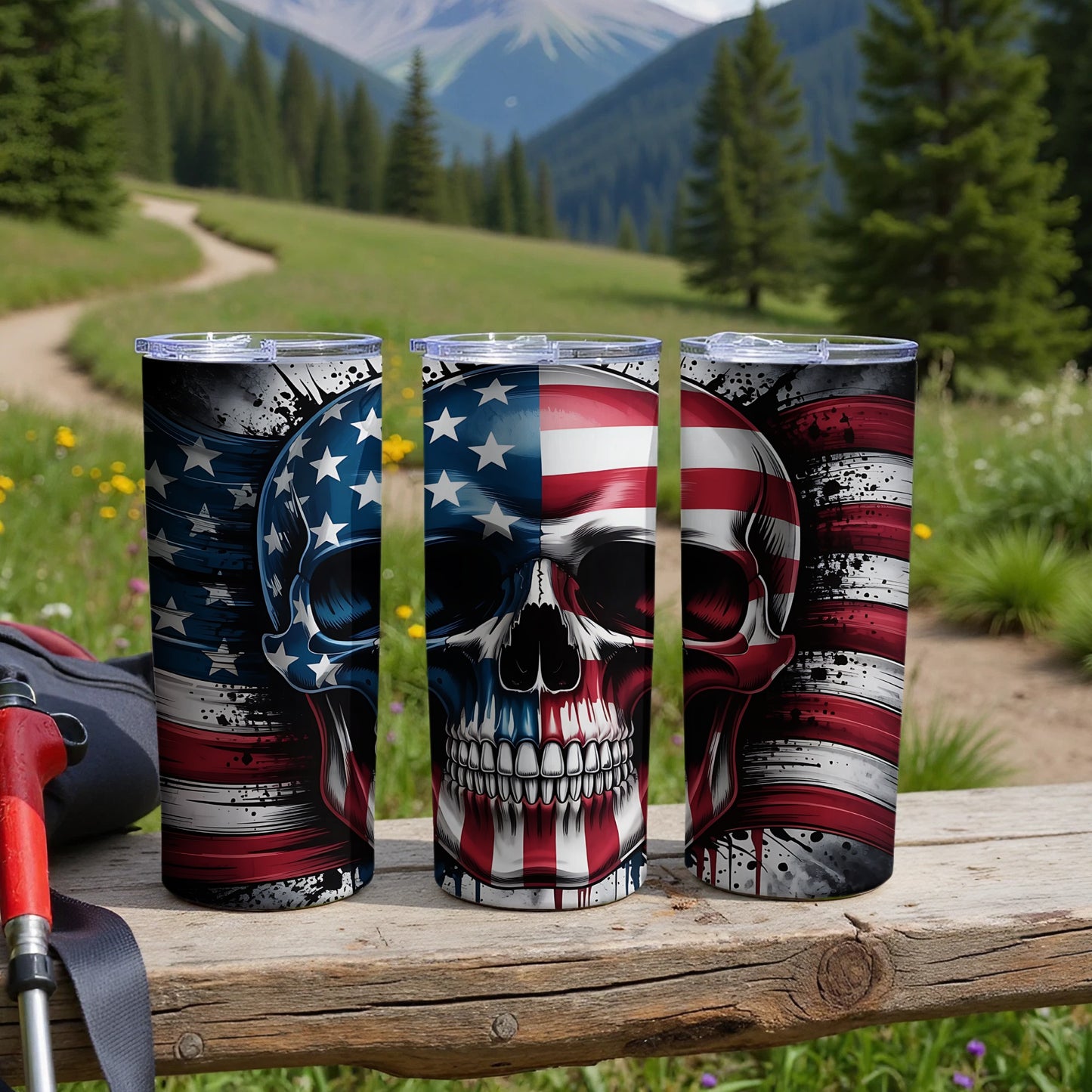 Three tumblers with American flag and skull designs on a wooden surface.