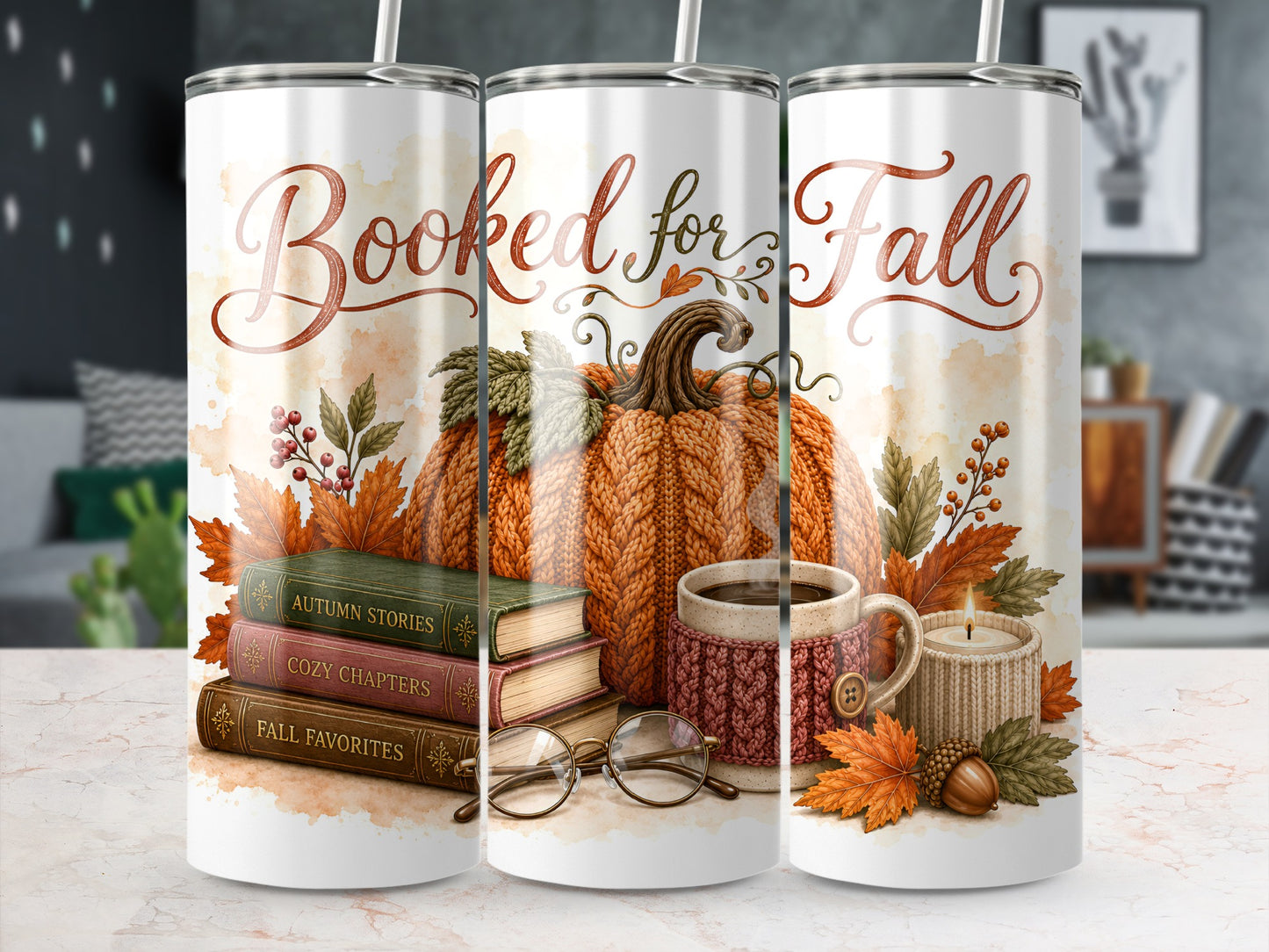 "Booked for Fall" tumbler with pumpkin, books, mug, candle, and fall leaves.
