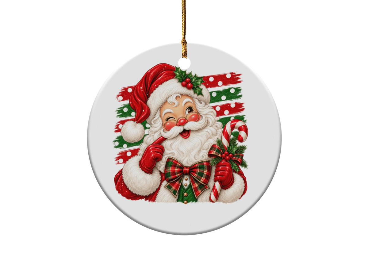 Round Christmas ornament featuring a winking Santa holding a candy cane and holly.