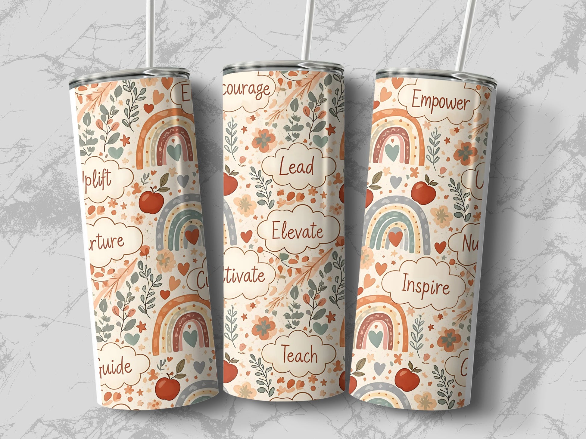 Three tumblers with rainbow and floral designs, featuring words like "uplift" and "courage."
