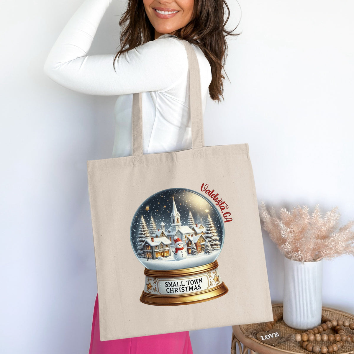 Tote bag with Valdosta, GA text and snow globe of "Small Town Christmas" scene.