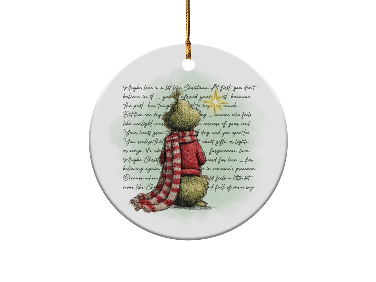 Round ornament featuring Grinch character and inspirational text about love and Christmas.