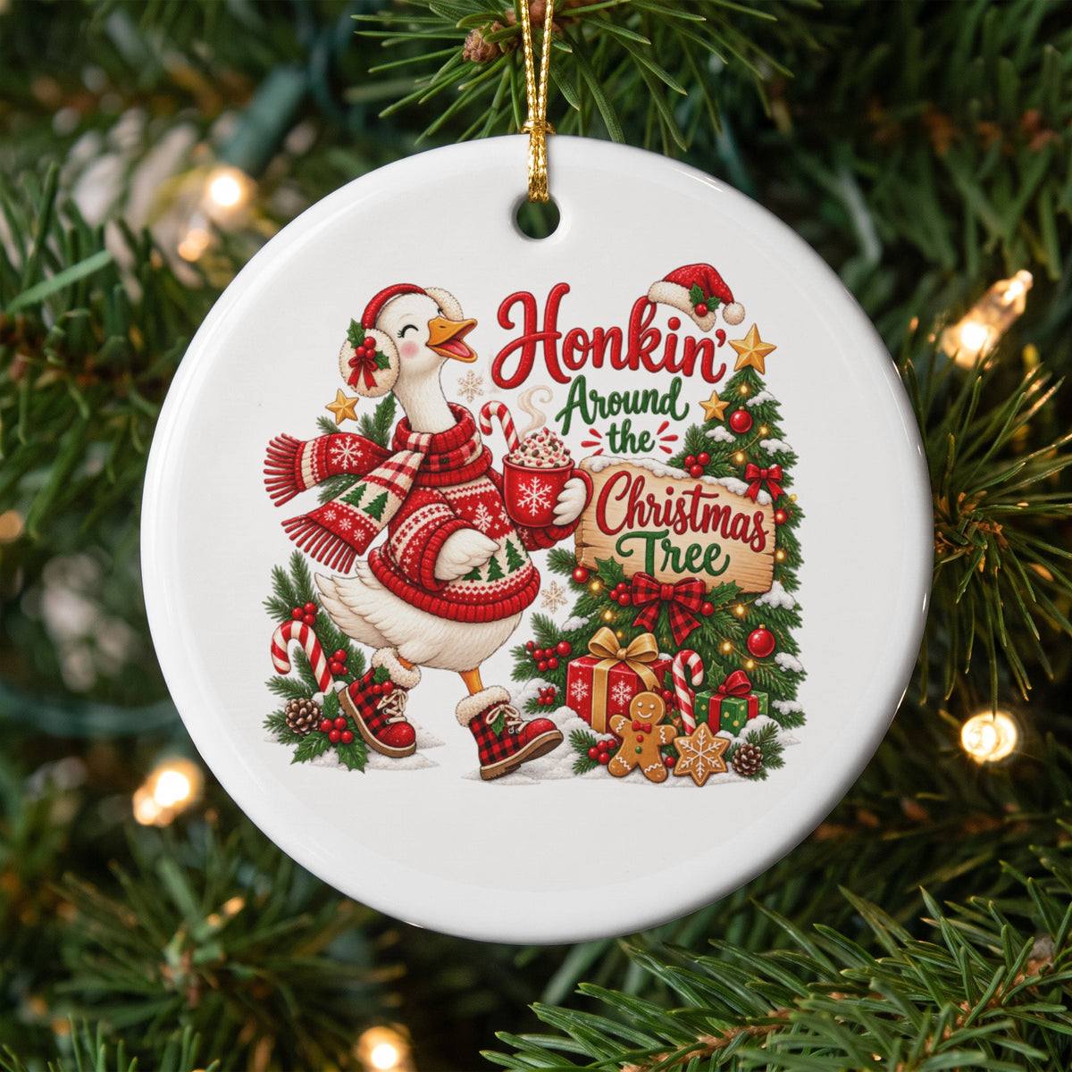 Christmas ornament with a duck in a sweater holding hot cocoa, text "Honkin' Around the Christmas Tree."